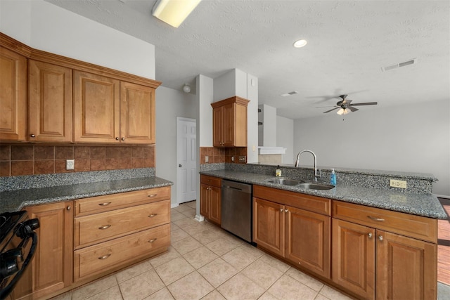 16935 Valley Palms Dr, Spring, TX 77379 - kitchen with a sink, stainless steel dishwasher, ceiling fan, decorative backsplash, and light tile patterned floors