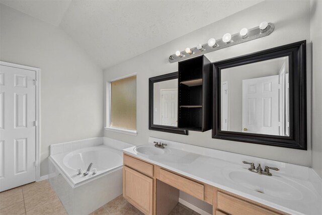 16935 Valley Palms Dr, Spring, TX 77379 - bathroom with lofted ceiling, tile patterned flooring, a bath, and double vanity