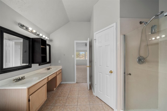 16935 Valley Palms Dr, Spring, TX 77379 - full bath with lofted ceiling, a shower, tile patterned floors, double vanity, and baseboards