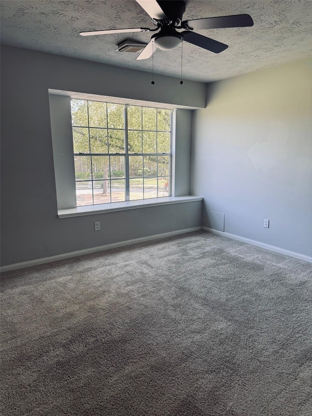 16935 Valley Palms Dr, Spring, TX 77379 - carpeted empty room with a textured ceiling, ceiling fan, and baseboards