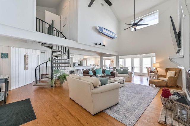 23155 Gulf Dr, Galveston, TX 77554 - living area with wood finished floors, stairway, a skylight, and a ceiling fan