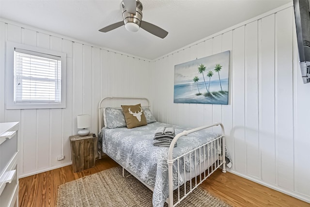 23155 Gulf Dr, Galveston, TX 77554 - bedroom with wood finished floors and a ceiling fan
