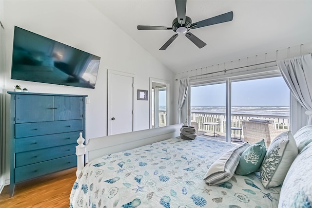 23155 Gulf Dr, Galveston, TX 77554 - bedroom featuring a ceiling fan, wood finished floors, vaulted ceiling, a water view, and access to outside