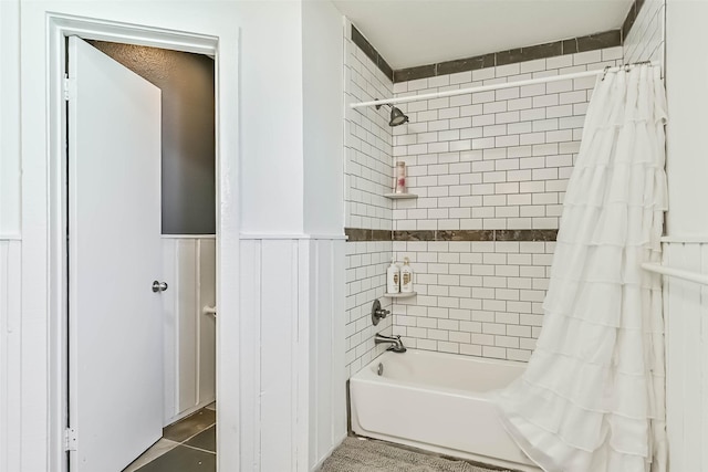 23155 Gulf Dr, Galveston, TX 77554 - full bathroom with shower / bath combo with shower curtain and a wainscoted wall