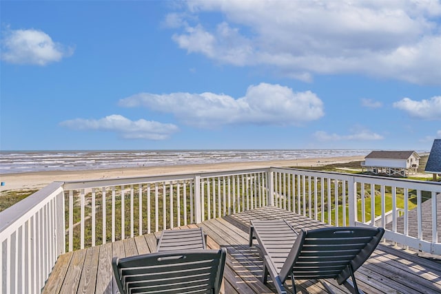 23155 Gulf Dr, Galveston, TX 77554 - wooden deck with a view of the beach and a water view