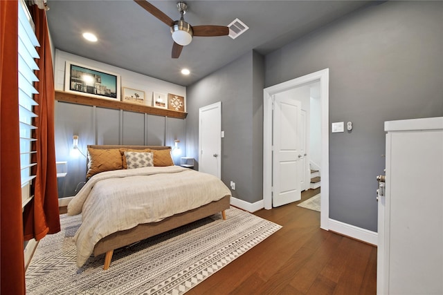 bedroom with visible vents, baseboards, ceiling fan, dark wood finished floors, and recessed lighting