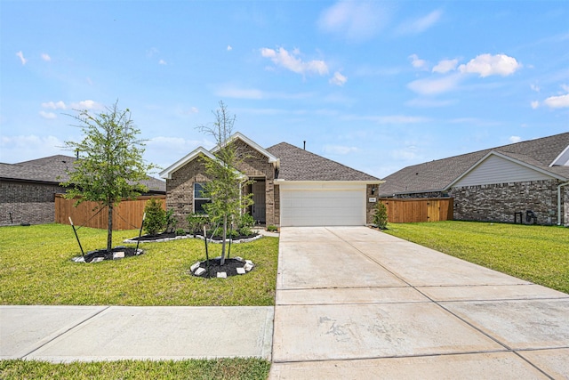 single story home featuring an attached garage, a front yard, fence, and brick siding