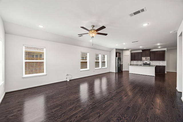 unfurnished living room with visible vents, baseboards, ceiling fan, dark wood finished floors, and recessed lighting
