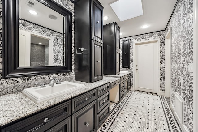 3126 Mid Ln, Houston, TX 77027 - bathroom with wallpapered walls and double vanity