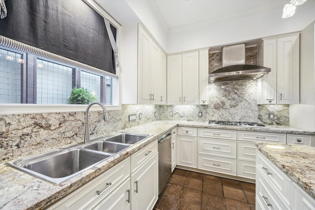 3126 Mid Ln, Houston, TX 77027 - kitchen with wall chimney exhaust hood, appliances with stainless steel finishes, tasteful backsplash, white cabinets, and ornamental molding