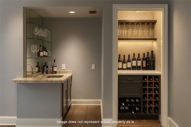 3126 Mid Ln, Houston, TX 77027 - wine area with wet bar and tile patterned floors