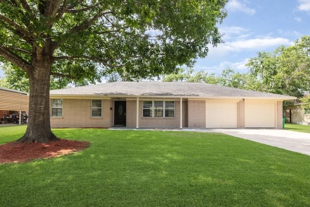 2005 Olive St, Baytown, TX 77520 - ranch-style home with an attached garage, driveway, a front yard, and brick siding