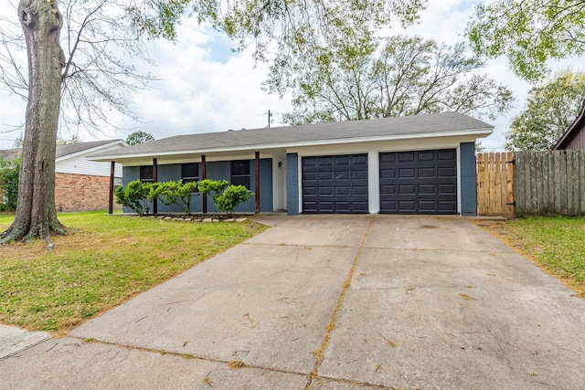 single story home featuring driveway, a front yard, roof with shingles, fence, and a garage