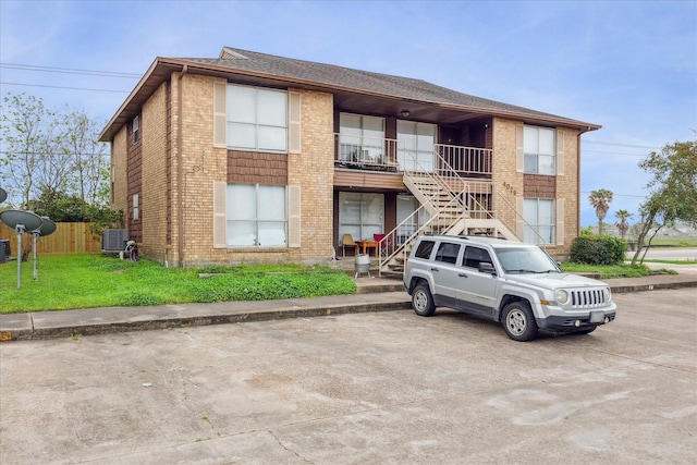4029 Briar Hollow Dr, Dickinson, TX 77539 - view of property with stairway, fence, and central AC