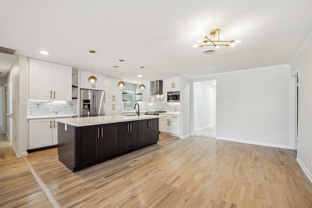 3427 Linkwood Dr, Houston, TX 77025 - kitchen with stainless steel appliances, light countertops, white cabinetry, decorative backsplash, and light wood finished floors