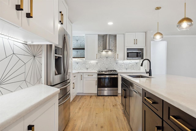 3427 Linkwood Dr, Houston, TX 77025 - kitchen featuring wall chimney exhaust hood, appliances with stainless steel finishes, a sink, light countertops, and white cabinets