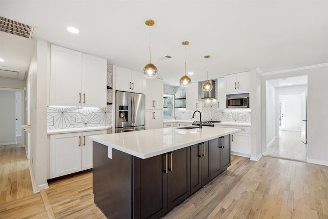3427 Linkwood Dr, Houston, TX 77025 - kitchen featuring appliances with stainless steel finishes, white cabinets, light countertops, a sink, and backsplash