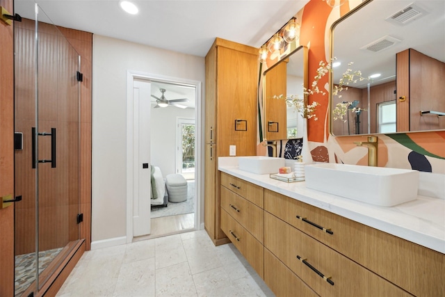 3427 Linkwood Dr, Houston, TX 77025 - bathroom featuring a shower stall, double vanity, a ceiling fan, recessed lighting, and baseboards
