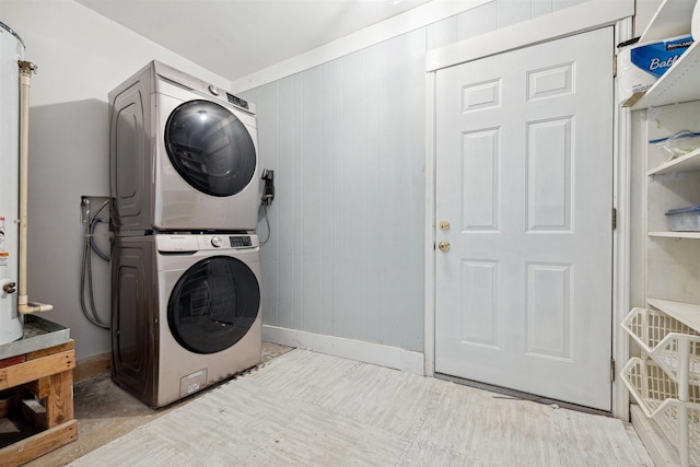 3427 Linkwood Dr, Houston, TX 77025 - laundry area with stacked washer and clothes dryer and baseboards