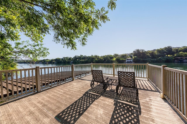 wooden deck with a water view