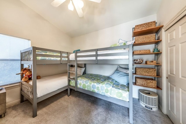 bedroom featuring carpet flooring, a ceiling fan, and vaulted ceiling