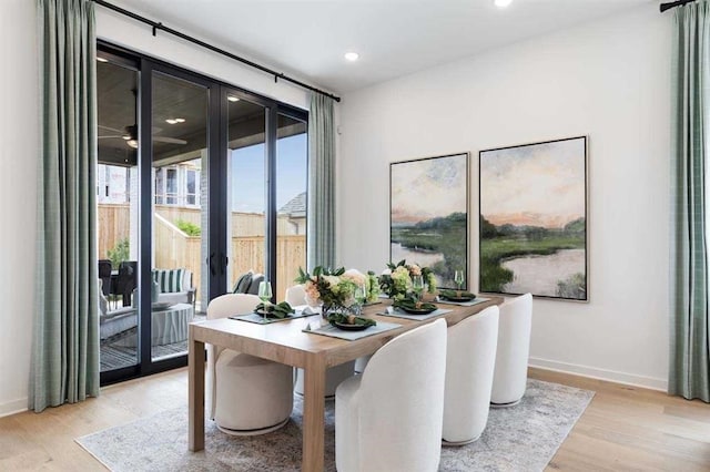 dining area featuring recessed lighting, baseboards, and light wood-type flooring