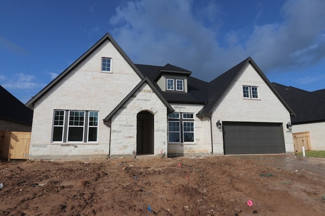 9710 Falling Leaf Dr, Missouri City, TX 77459 - view of front facade featuring an attached garage, brick siding, driveway, and stone siding