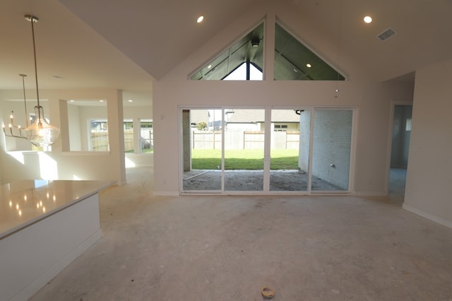 9710 Falling Leaf Dr, Missouri City, TX 77459 - unfurnished living room featuring lofted ceiling, recessed lighting, and a chandelier