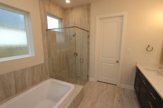 9710 Falling Leaf Dr, Missouri City, TX 77459 - full bathroom featuring a stall shower, a garden tub, and vanity