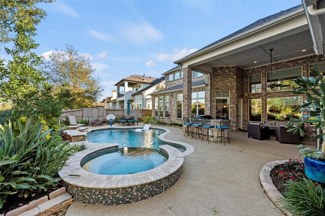 27402 Hollow Pass Ln, Katy, TX 77494 - view of pool featuring a patio, a fenced backyard, an outdoor living space, and a pool with connected hot tub