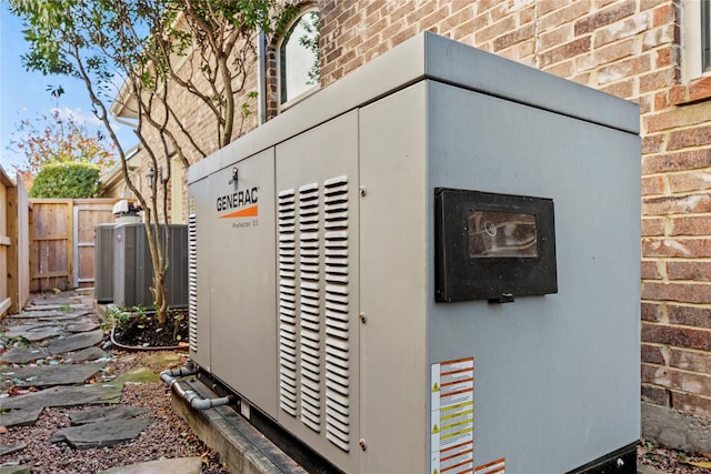 exterior details with brick siding, fence, a power unit, and central air condition unit