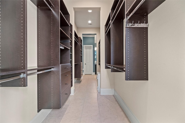 walk in closet featuring tile patterned flooring and visible vents