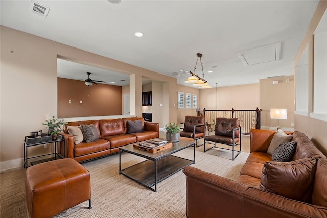 living area with visible vents, ceiling fan, and recessed lighting