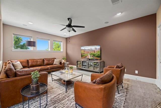 living area featuring visible vents, ceiling fan, and recessed lighting