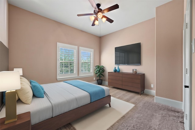 bedroom featuring baseboards and a ceiling fan