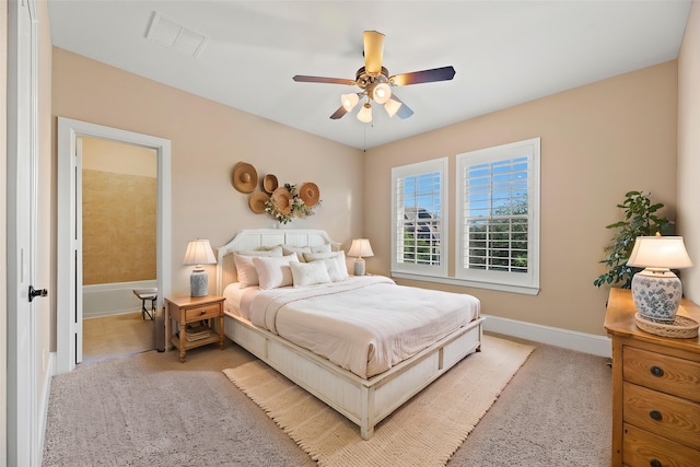 bedroom featuring light carpet, baseboards, a ceiling fan, and visible vents