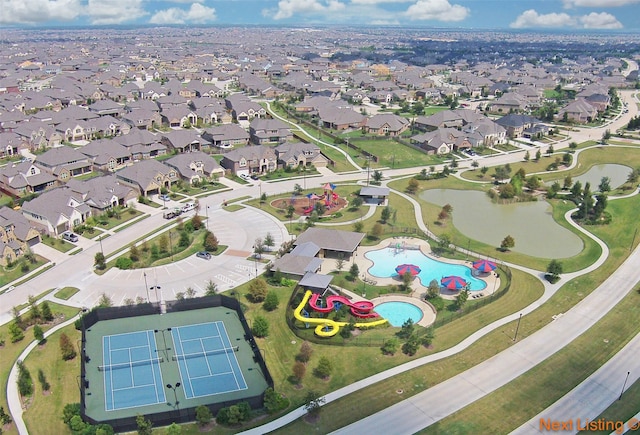 birds eye view of property featuring a water view and a residential view