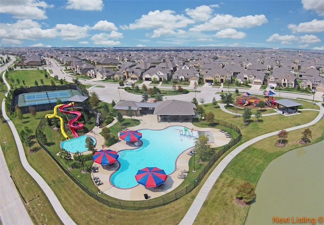 birds eye view of property with a residential view