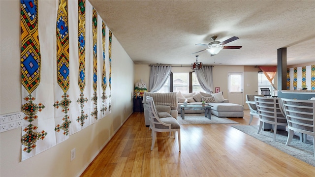 2202 Tandy Park Way, Houston, TX 77047 - living area with hardwood / wood-style flooring, a ceiling fan, and a textured ceiling