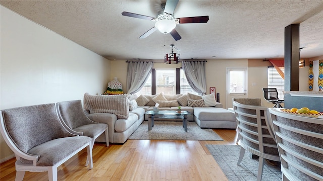 2202 Tandy Park Way, Houston, TX 77047 - living area with a ceiling fan, light wood-style floors, and a textured ceiling