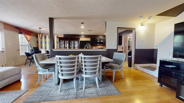 2202 Tandy Park Way, Houston, TX 77047 - dining area with recessed lighting, a textured ceiling, and light wood-type flooring