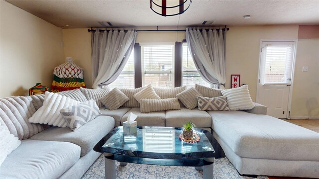 2202 Tandy Park Way, Houston, TX 77047 - living room with visible vents, a healthy amount of sunlight, and a textured ceiling