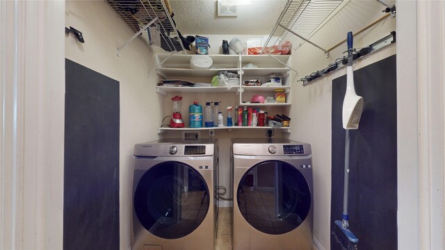 2202 Tandy Park Way, Houston, TX 77047 - clothes washing area with a textured ceiling, laundry area, and washing machine and clothes dryer