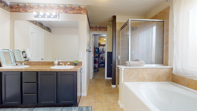 2202 Tandy Park Way, Houston, TX 77047 - full bathroom with a walk in closet, a shower stall, a garden tub, and a sink