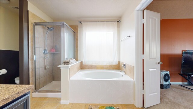 2202 Tandy Park Way, Houston, TX 77047 - bathroom with tile patterned floors, toilet, a stall shower, a bath, and vanity