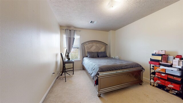 2202 Tandy Park Way, Houston, TX 77047 - carpeted bedroom featuring visible vents, baseboards, and a textured ceiling