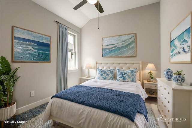 bedroom with ceiling fan, baseboards, carpet, and lofted ceiling