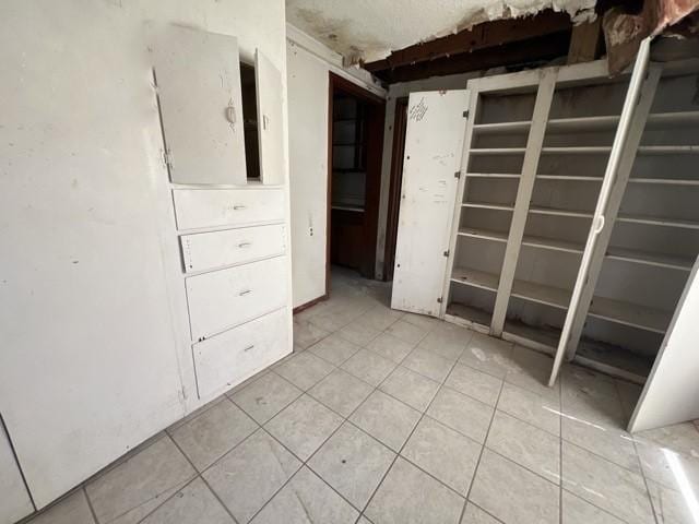 spare room with light tile patterned floors