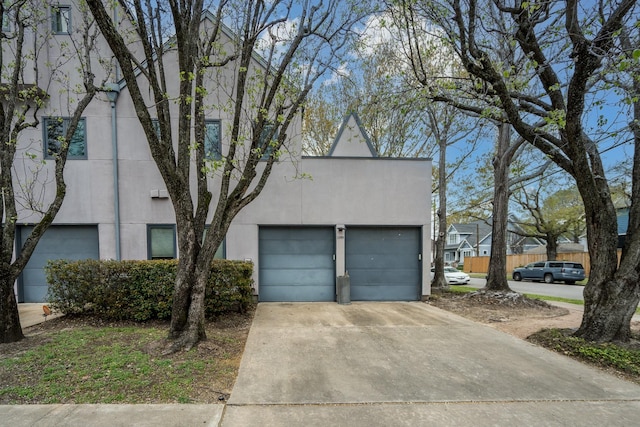 1395 Arlington St Unit 1395, Houston, TX 77008 - view of front of property featuring stucco siding and concrete driveway