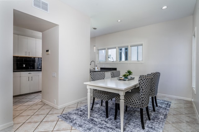 1395 Arlington St Unit 1395, Houston, TX 77008 - dining space featuring recessed lighting, light tile patterned flooring, and baseboards
